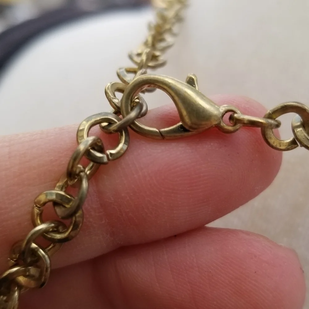 layered gold tone chain necklace with dyed shell accents